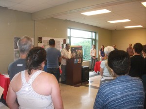 Chicago Alderman Rey Colon addresses the open house audience.