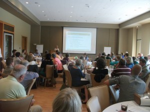 A full room listens as Lydia Scott outlines data behind the Chicago Regional Trees Initiative. 