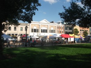 The University of Iowa Pentacrest (green area) is literally across the street from the downtown business district (background). Here, Clinton Street is closed, and booths set up, for the Iowa Soul Festival, part of Iowa City's Summer of the Arts. 