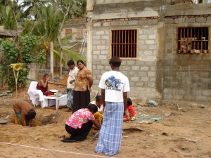 Sri Lankans dedicate new housing built in 2005, after the Indian Ocean tsunami, in a Buddhist ceremony. 