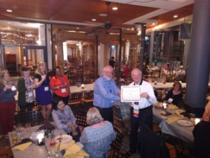 The night after the FAICP induction, at their division reception, members of the new APA division jokingly award me an "F" to go with my AICP. Alongside me is Barry Hokanson, HMDR chairman.