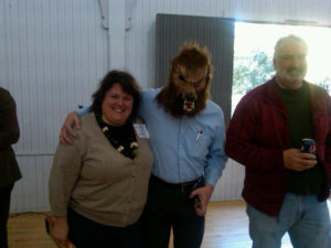 Allison Hardin poses with the wolf; David Hart observes (September 2011). Photo by Melissa Ladd. 