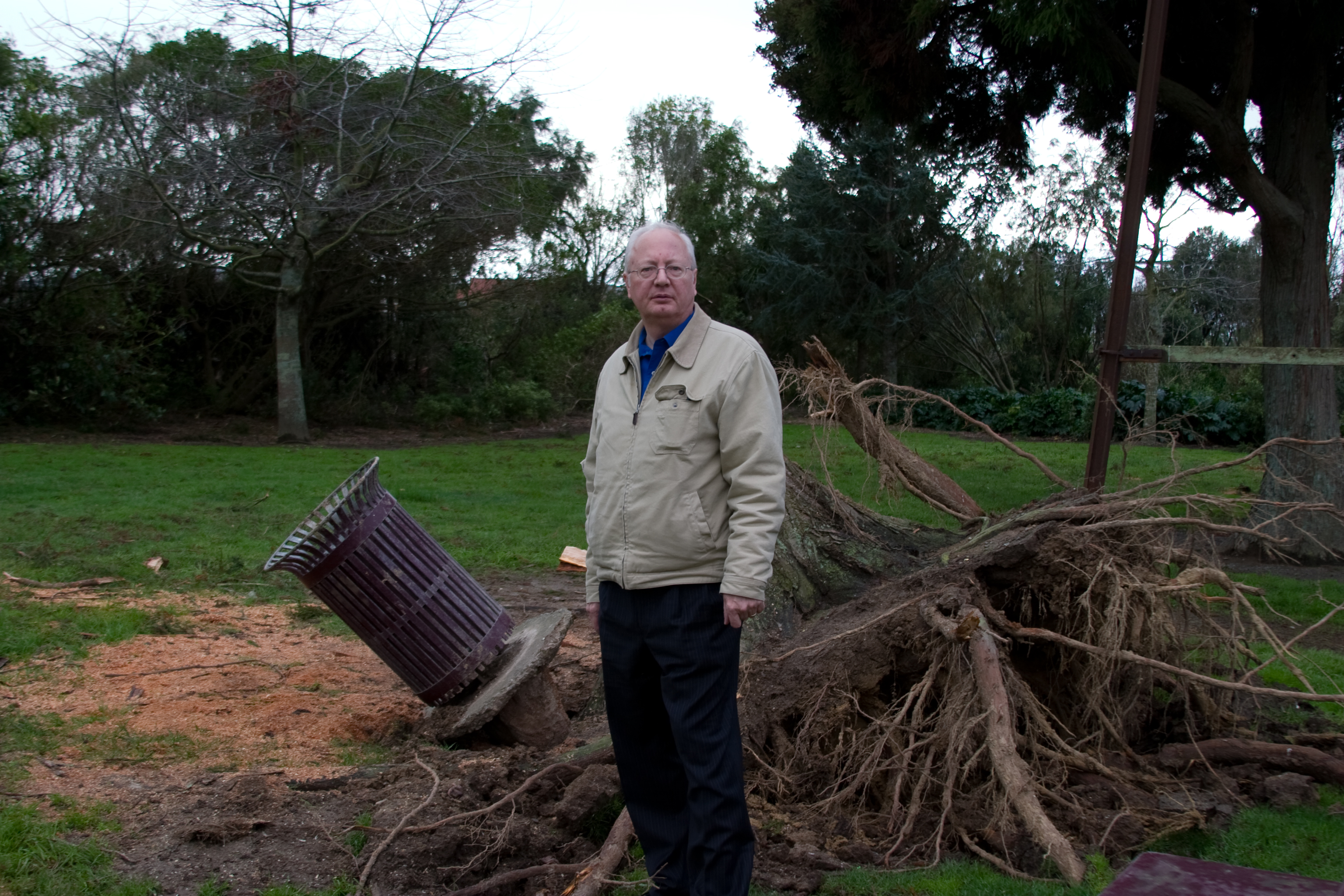 Jim Schwab in front of tree damage